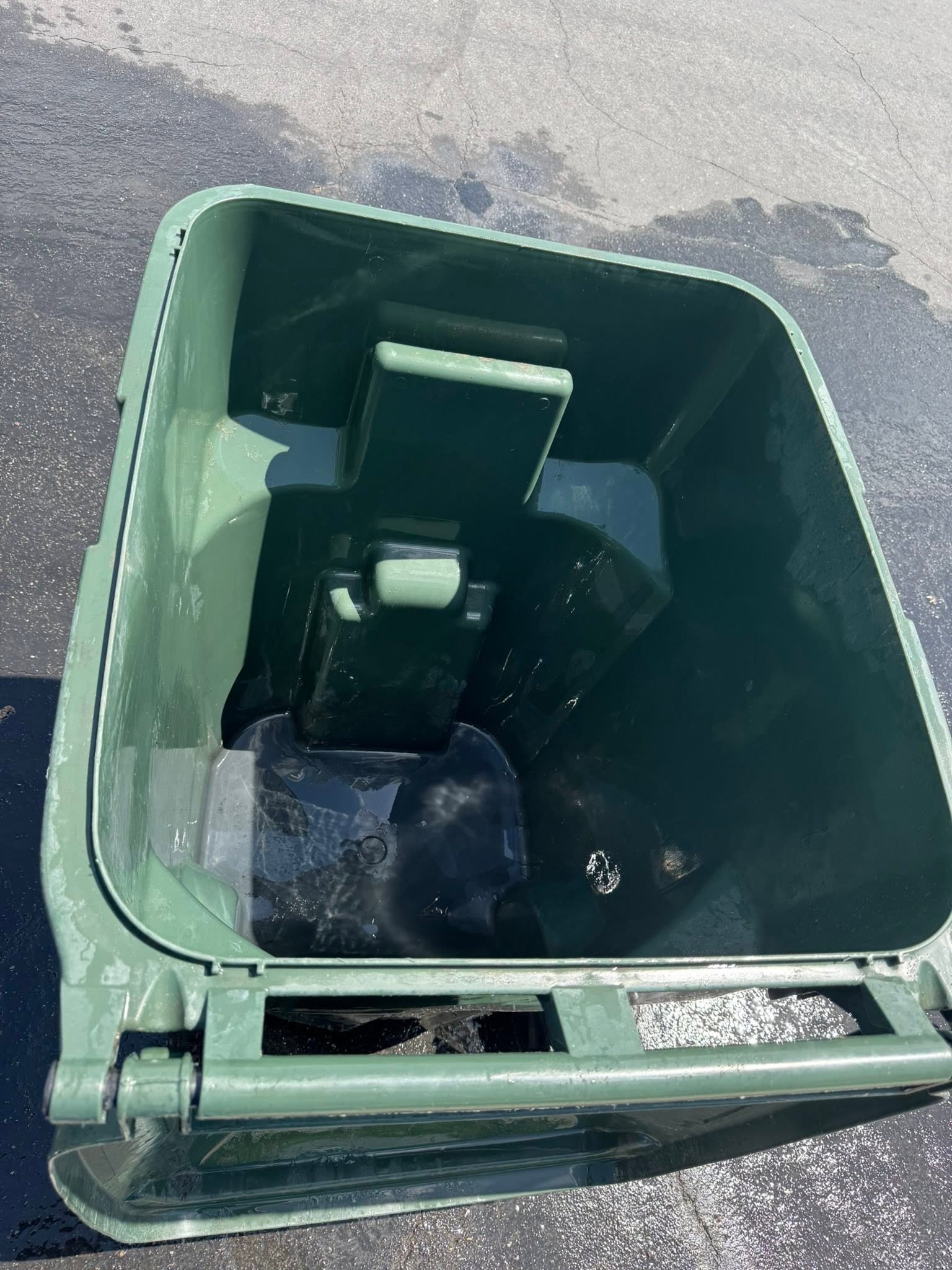 A freshly sanitized garbage can interior after cleaning
